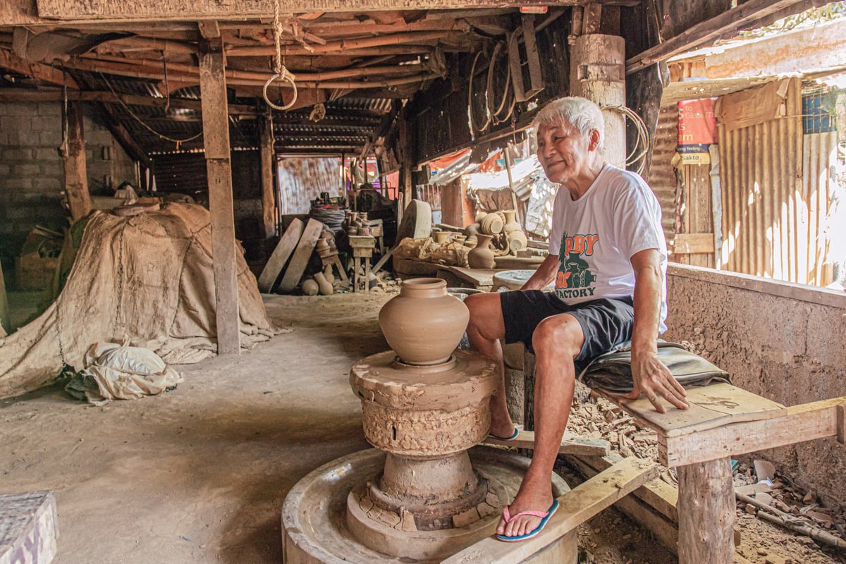 Man Sitting by a Pottery Wheel