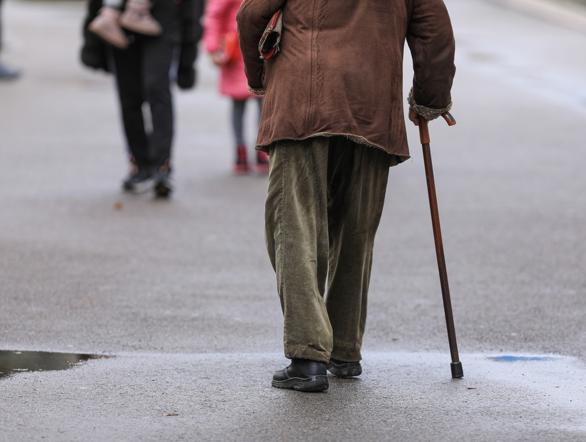 old man with a cane on the street