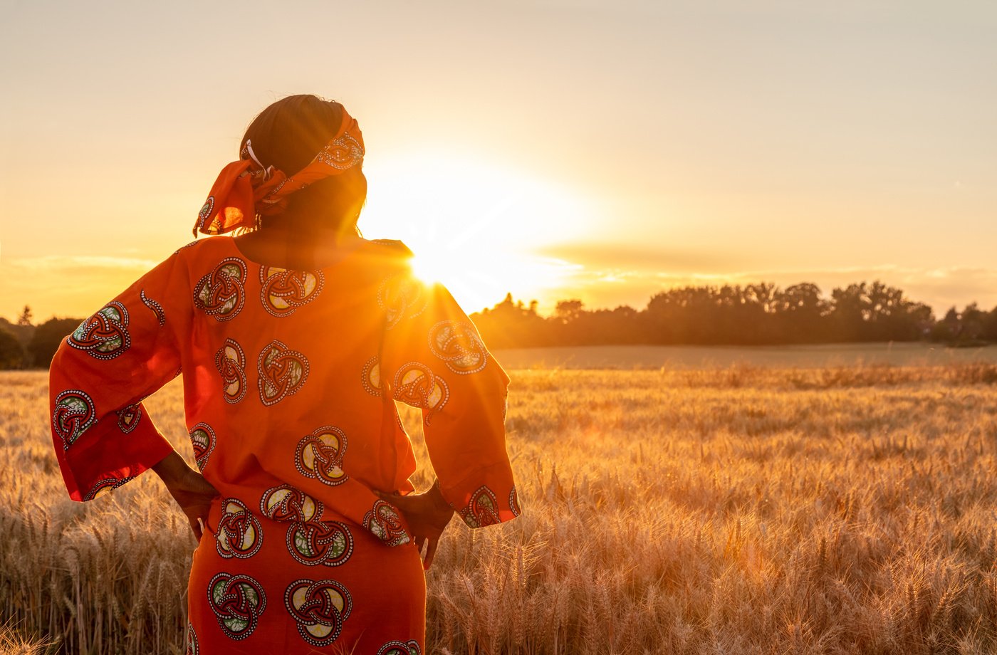 Woman in Ethnic Clothes Watching the Sunset 